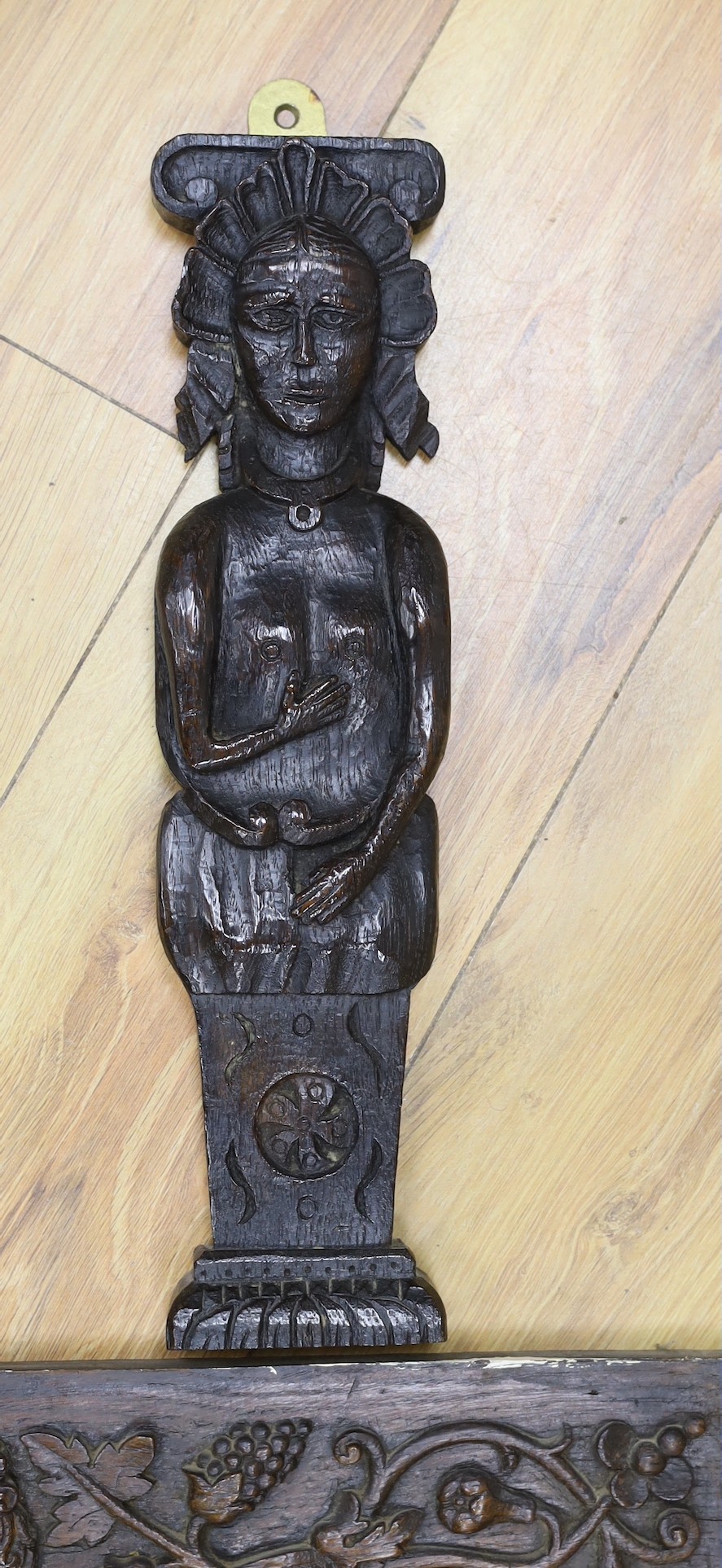 A 17th carved oak figural corbel, a pair of carved oak corbels and a carved oak frieze 14x19cm